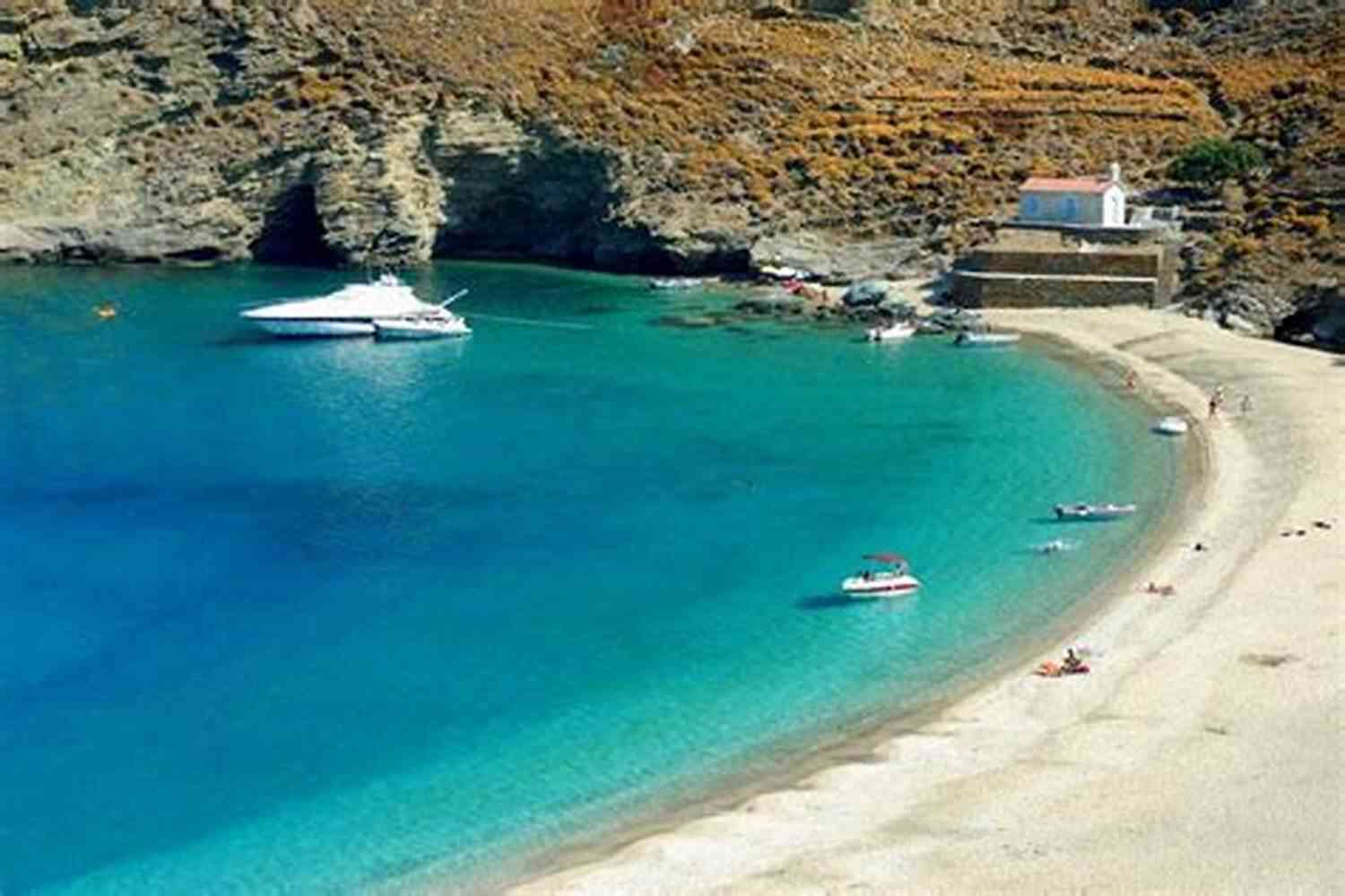 A Quiet Beach With Golden Sands And Crystal Clear Waters Where The World Is Quiet