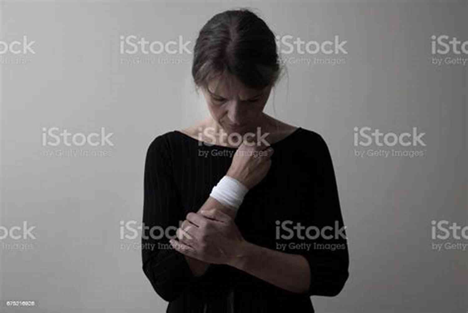 Woman With Bandaged Hands Holding Unbroken Chains, Representing Her Untouched Wounds Broken: Untouched Wounds Tasha Waller
